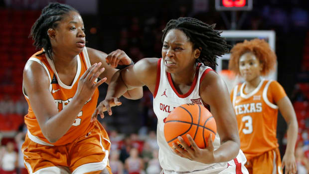 Oklahoma Sooners guard Madi Williams (25) goes past Texas Longhorns forward DeYona Gaston (5) during a women's college basketball game between the University of Oklahoma Sooners (OU) and the Texas Longhorns at Lloyd Noble in Norman, Saturday, Jan. 29, 2022. Oklahoma won 65-63. Ou Women Vs Texas